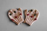 hand knitted beige mitten with colorful pops